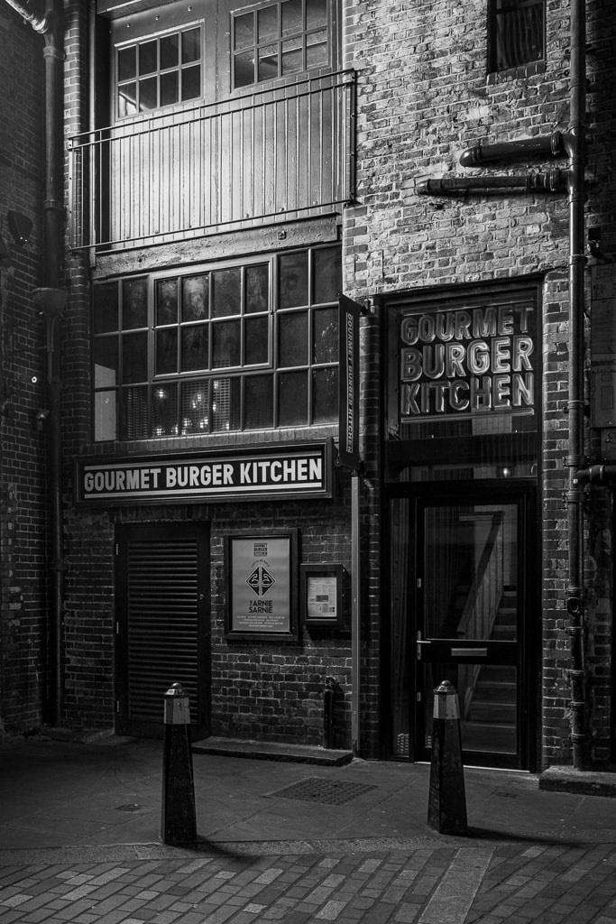 Gourmet Burger Kitchen, London courtyard, monochrome photo